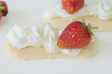 Biscuits with Cream and Strawberries isolated on a White Background
