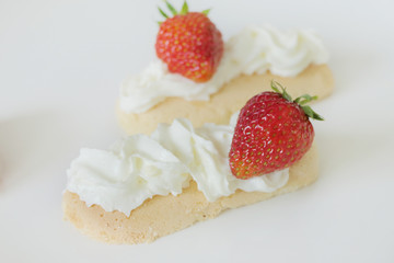 Biscuits with Cream and Strawberries isolated on a White Background