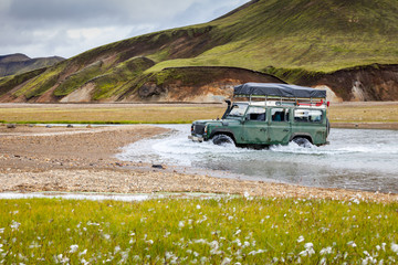 4WD car wades river, Iceland - 275356986