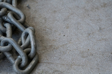 Chain on Textured Cement