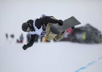 Snowboarder does a trick