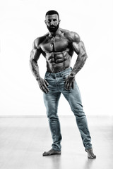 Fototapeta na wymiar Strong Muscular Shirtless Men in Jeans Posing