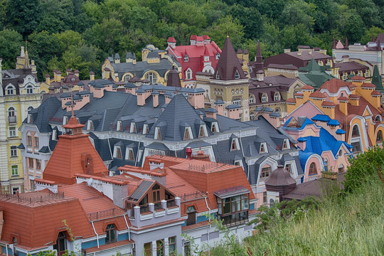 Roofs of colorful beautiful houses surrounded by trees. Kiev, Ukraine