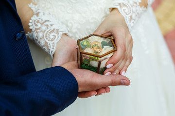 Golden wedding rings for newlyweds on their wedding day