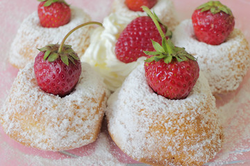 Mini Cakes with Strawberries isolated on a Pink Background