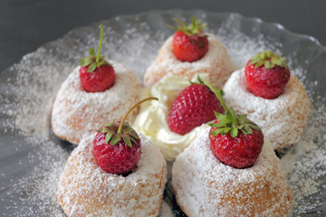 Mini Cakes with Strawberries isolated on a Black Background