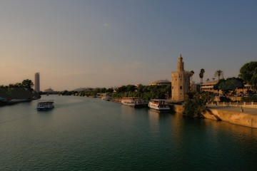 Obraz premium Seville sunset skyline torre del Oro in Sevilla Andalusia Spain
