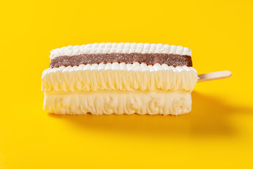 side view fresh chocolate and milkshake flavor popsicle on a yellow background