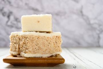 side view traditional sweet scented osmanthus cake on a white table