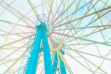 Ferris Wheel Over Blue Sky..