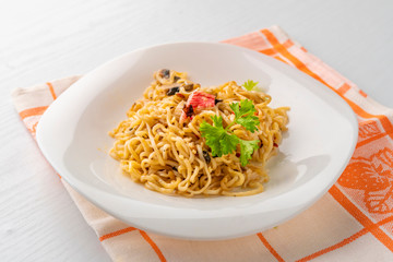 cooked hot meal or dish with spaghetii crab meat mushrooms and spice