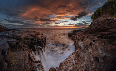 sunset on coast of sea