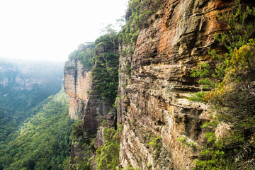 Cliffs and canyons along the Three Sisters with view to Echo Point with backlight, Katoomba, New South Wales, Australia