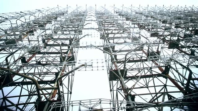 Close-up slow-motion view of large the Arc of Duga telecommunication radio center in Chernobyl radiation zone. Tour to exciting place of nuclear power plant with history on north of Ukraine.