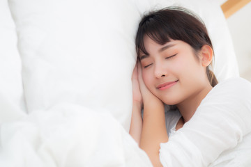 Obraz na płótnie Canvas Beautiful asian young woman sleeping lying in bed with head on pillow comfortable and happy. girl with relax for health concept.