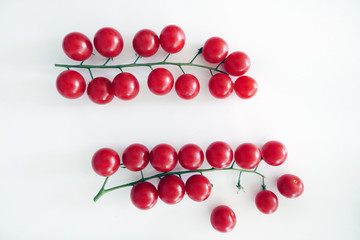 Branch of Cherry Tmatoes isolated on a White Background