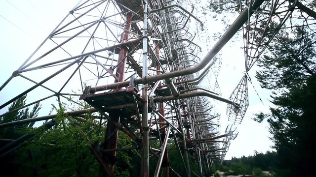 Dark tourism in Prypiat, Ukraine. View of massive antenna tower used to be a radar system of Soviet Union at Chernobyl power station.