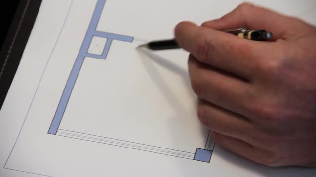 Architect explaining floor plans to a client.