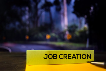 Job Creation on the sticky notes with bokeh background