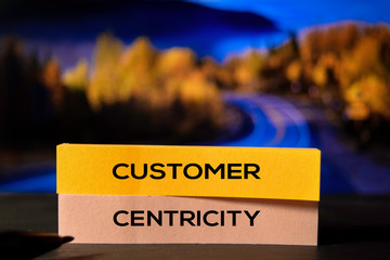 Customer Centricity on the sticky notes with bokeh background