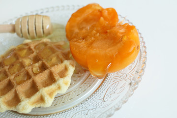 Waffle with Honey and Apricots isolated on a White Background