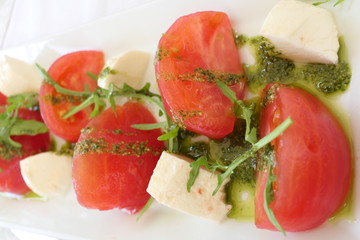 Traditional Italian Salad with Tomatoes, Mozarella and Pesto
