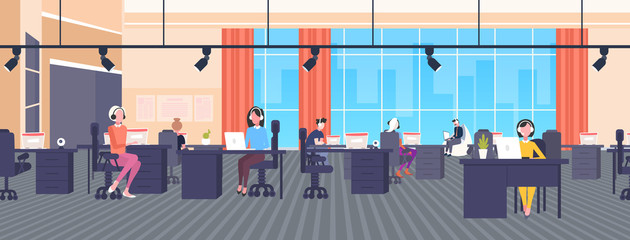 coworkers in headset operators sitting at workplace desks call center concept co-working open space modern office interior flat horizontal banner full length