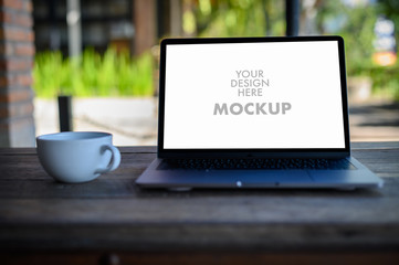 Mockup of business man using laptop screen for your advertising text message Laptop with blank...