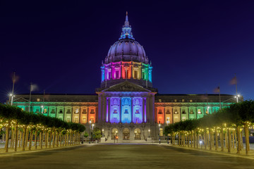 San Francisco City Hall illuminated in rainbow colors for the Pride Parade.