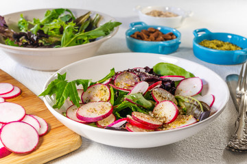Herb Salad Mix with Radish, Close Up on a Kitchen Table 