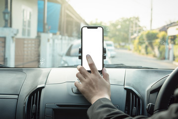 woman searching destination direction or address on gps or navigator application via mobile smartphone inside a car while driving car, close up