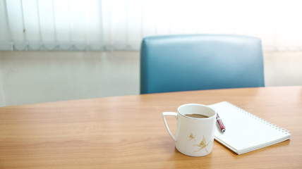 white cup of coffee on table