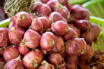 Shallots. Fresh purple shallots on basket.