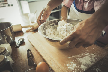 happy family in kitchen. family knead dough and bake the bakery together in kitchen