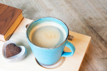 Hot Cappuccino In Cup On Wooden Table With Copy-space. The Latte Art On coffee background.