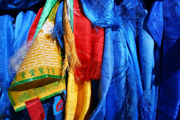 Sacred hadags or khadags (blue silk scarves) and prayer flags close-up, Mongolia.