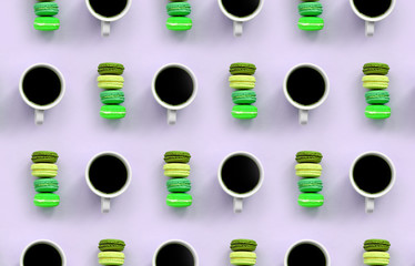 A pattern of many colorful dessert cake macaroon and coffee cups on trendy pastel lilac background top view
