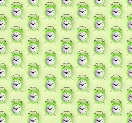 Wasting time concept. Many green alarm clock