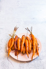 Carrots. Baked orange sweet on white background. Space for text
