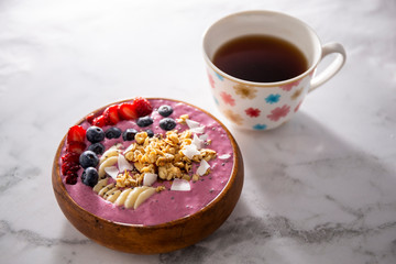Obraz na płótnie Canvas Smoothie bowl with fruits in wooden bowl