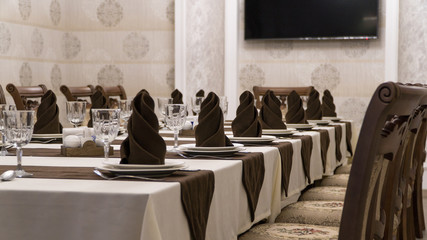 serving banquet table in a luxurious restaurant in brown and white style