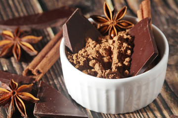 Cocoa powder and a bar of dark chocolate	