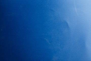 Bright abstract dirty blue texture with scratches and scuffs