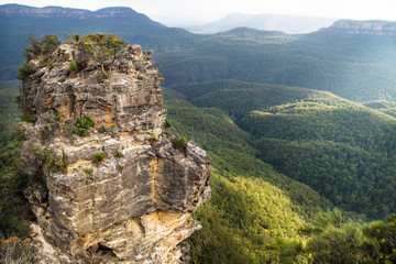 One rock formation of the Three Sisters with view to the valley and canyons from Spooners lookout, New South Wales, Australia