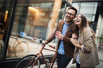 Happy smiling young couple having fun in the city