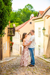 Young couple walking in old town of Prague
