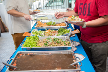 Food Buffet Catering Dining Eating Party Sharing Concept.people group catering buffet food indoor in luxury restaurant with meat colorful fruits and vegetables