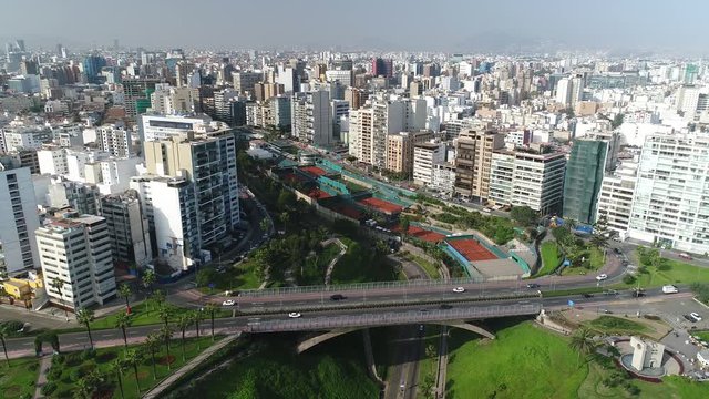Pullback view of Miraflores and riseup to show Lima city, in Peru.