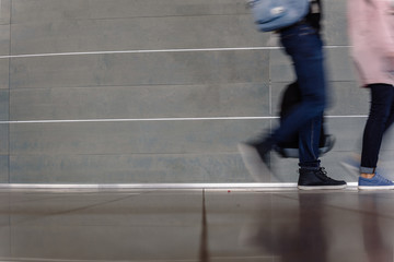 Closeup of busy people at rush hour walking on city street