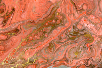 Pink and gold marbling pattern. Golden marble liquid texture.